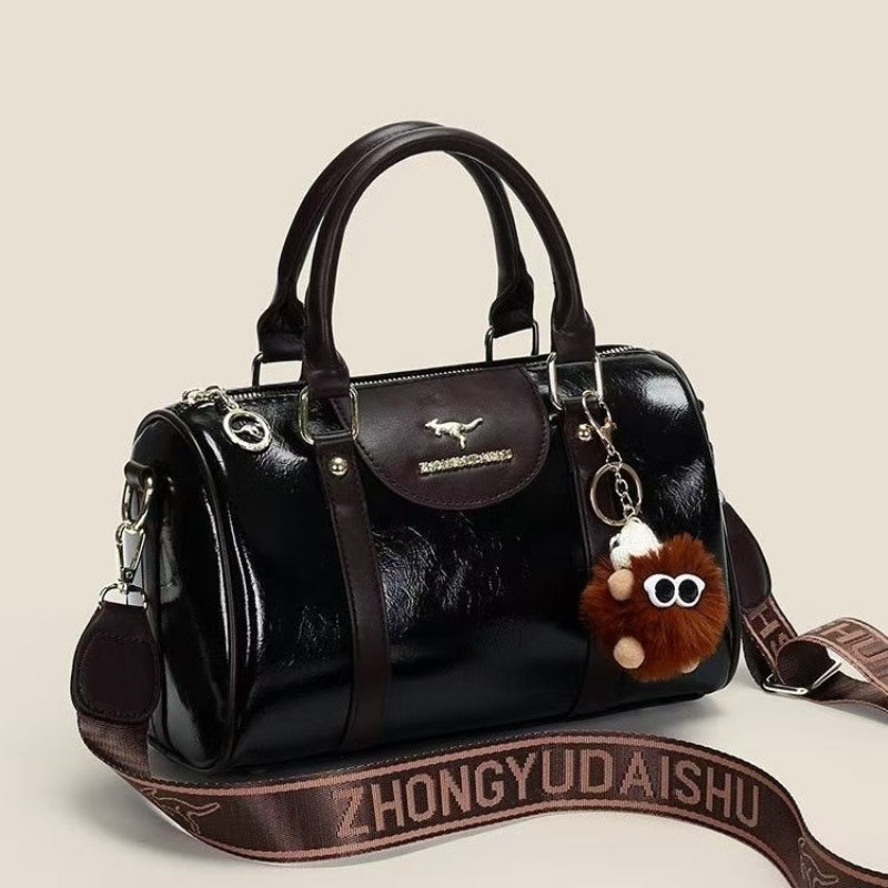 Women's Glossy Handbag with Playful Furry Pendant
