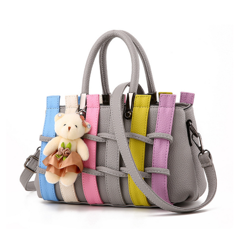 Fashionable woven handbag featuring cute bear pendant charm