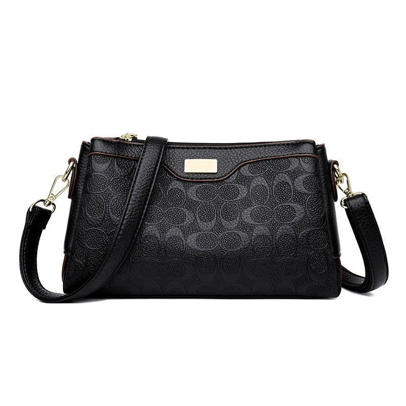 Noir Embossed Accordion Crossbody Bag