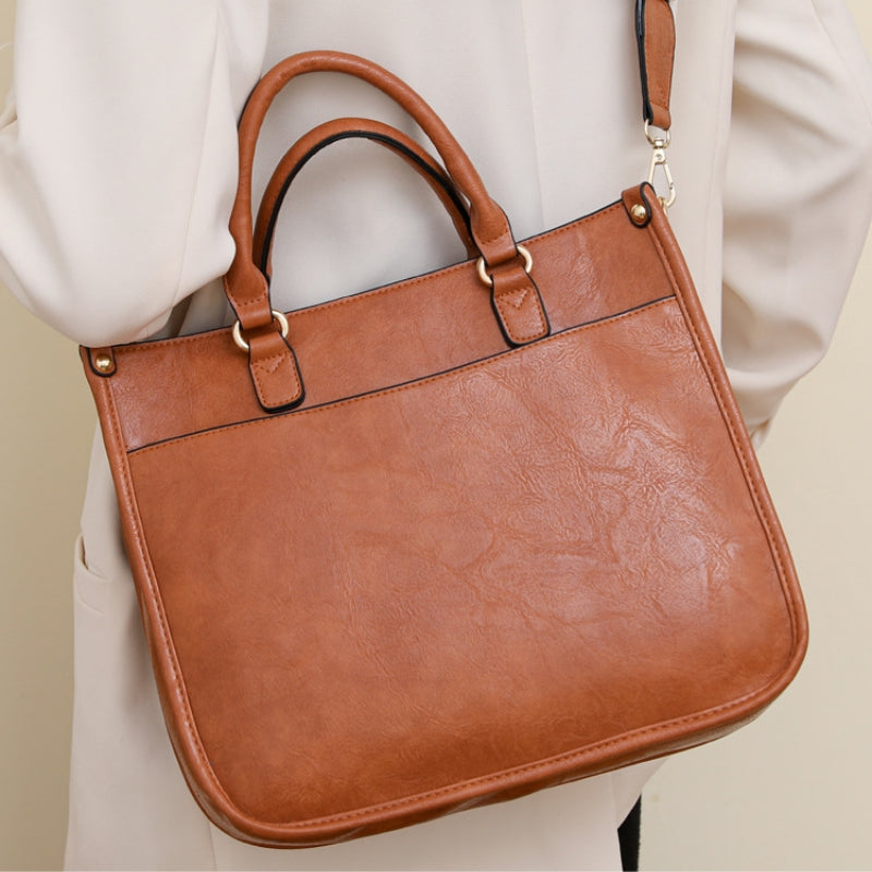 Modern Curved Twist Lock Asymmetrical Handbag